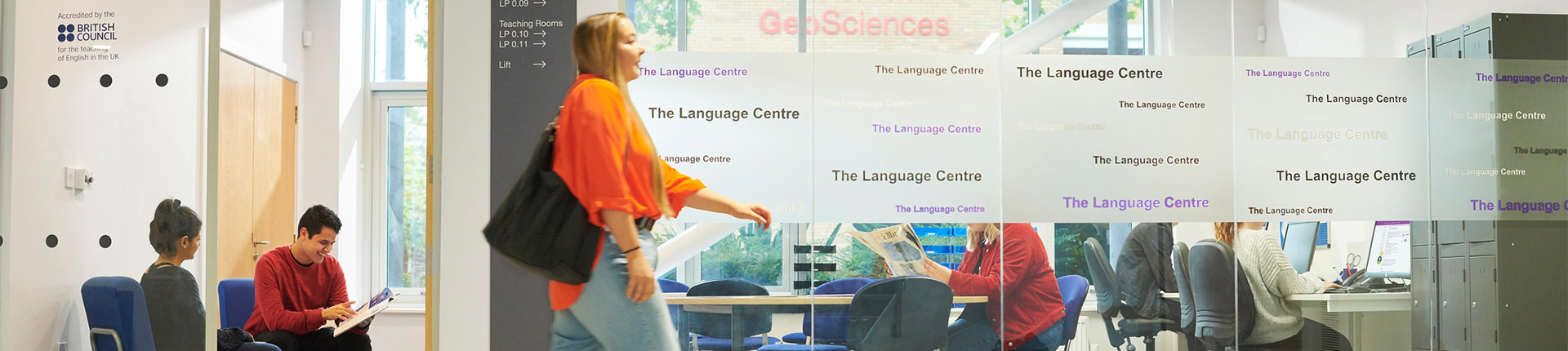A student walks outside the language centre room