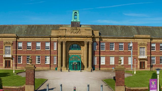 An image of the front of the Main Building of the Edge Hill University campus.