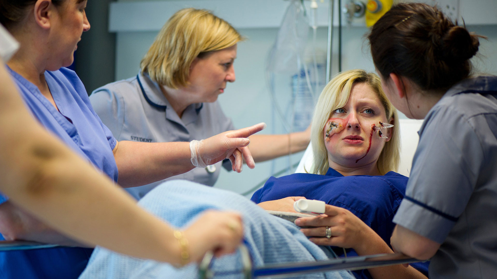 Nursing students attending to a patient in a simulation setting. CSSC