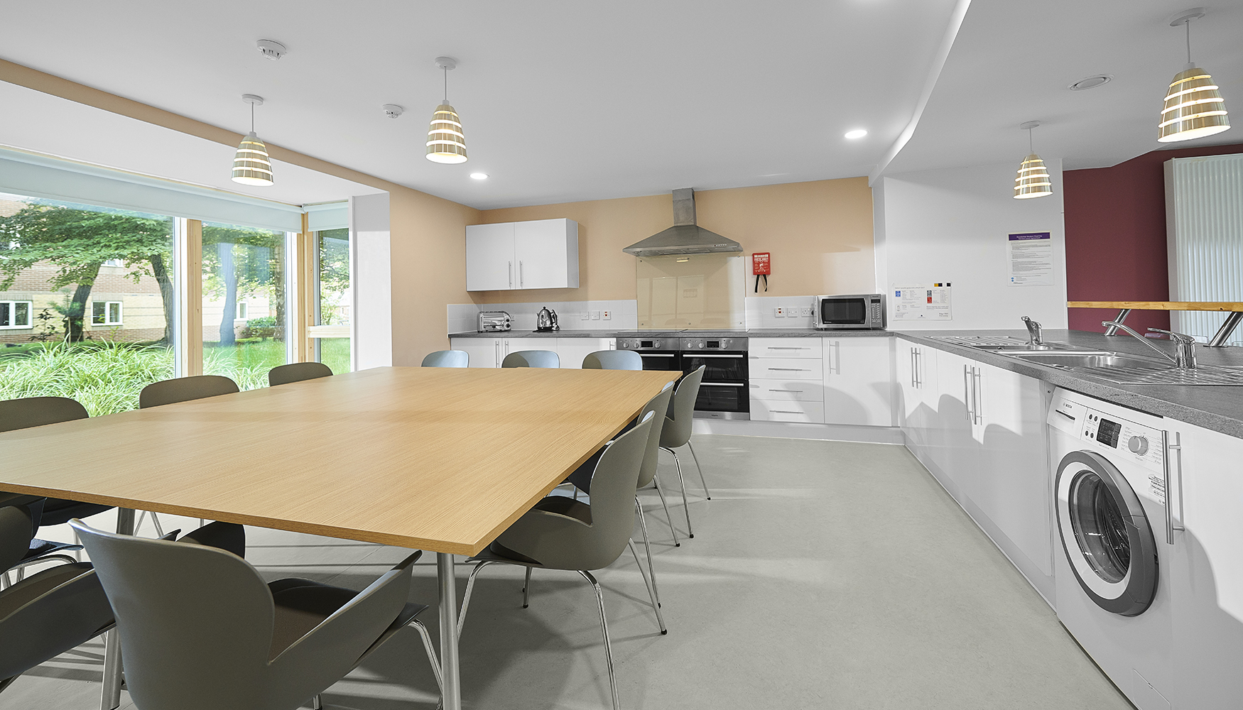 Empty kitchen and dining area in Woodland Court.