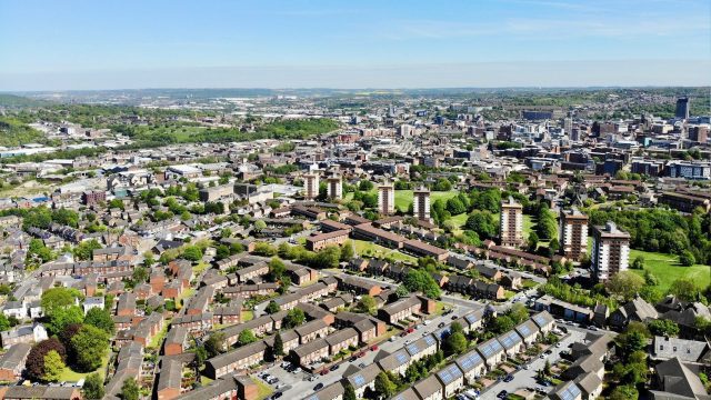 An aerial view of a town in daylight.