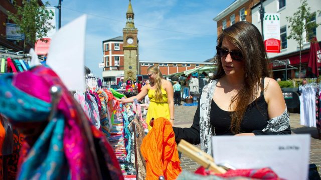 An image of people looking at the various stalls in Ormskirk market. 