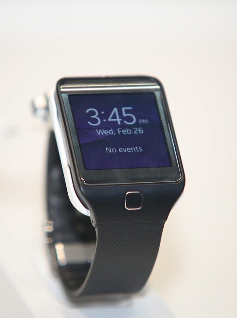 Image of smart watch displaying current date and time.
