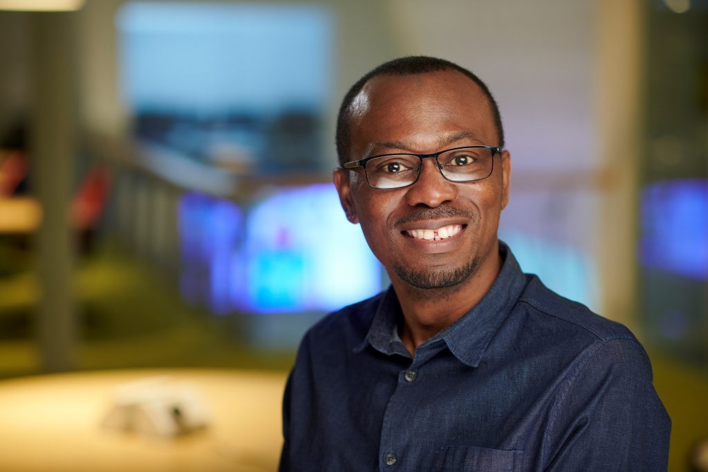 Nonso Namoko sitting by computers