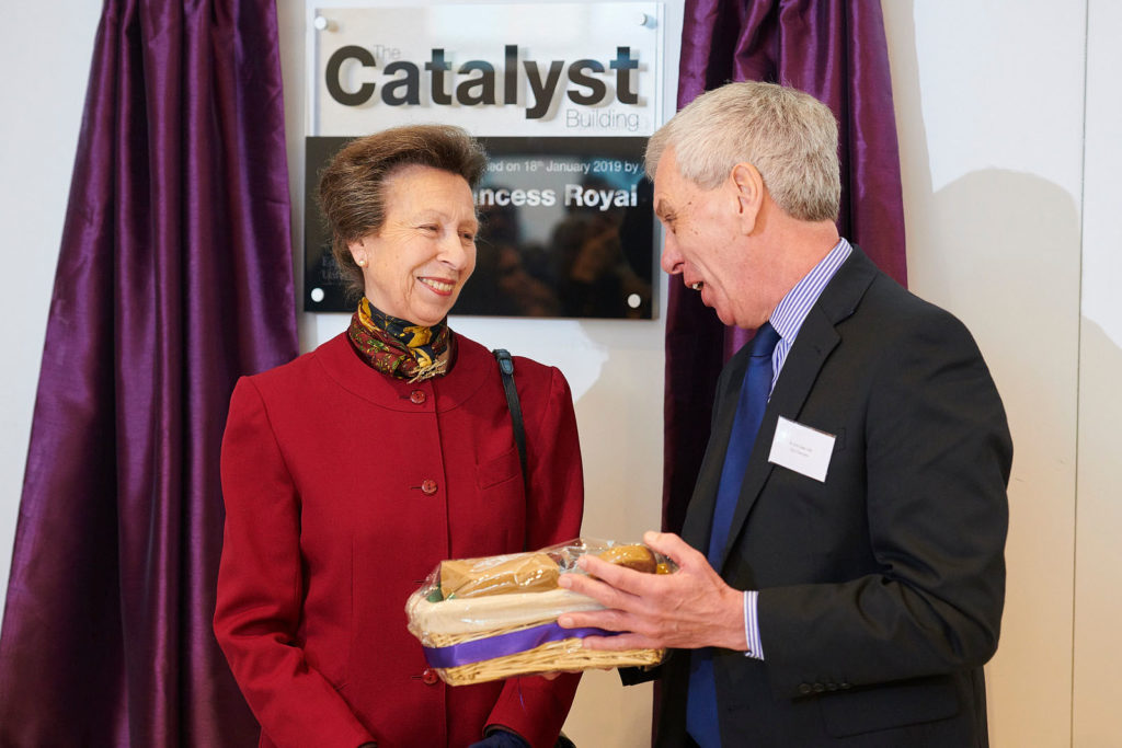Edge Hill University's Vice Chancellor Dr John Cater presents HRH The Princess Royal with gingerbread from Ormskirk's Mr Thompsons Bakery
