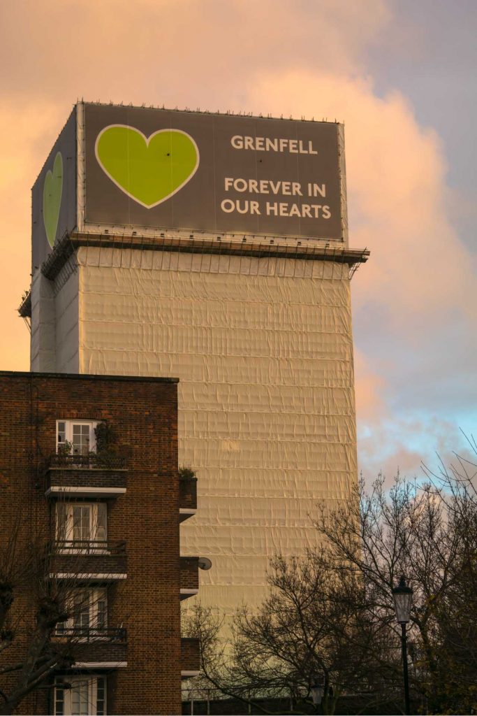 An image of the Grenfell Tower covered in a banner. 