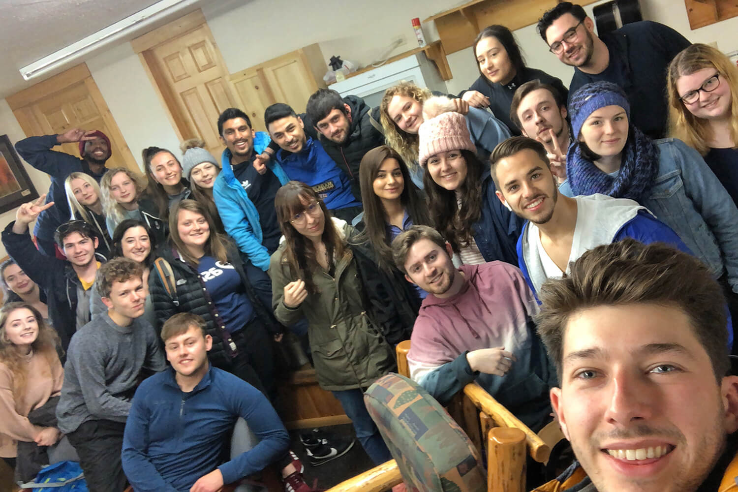 16 Edge Hill students and 11 international students from a partner university pose for a group photo during the trip of a lifetime to Yellowstone National Park.