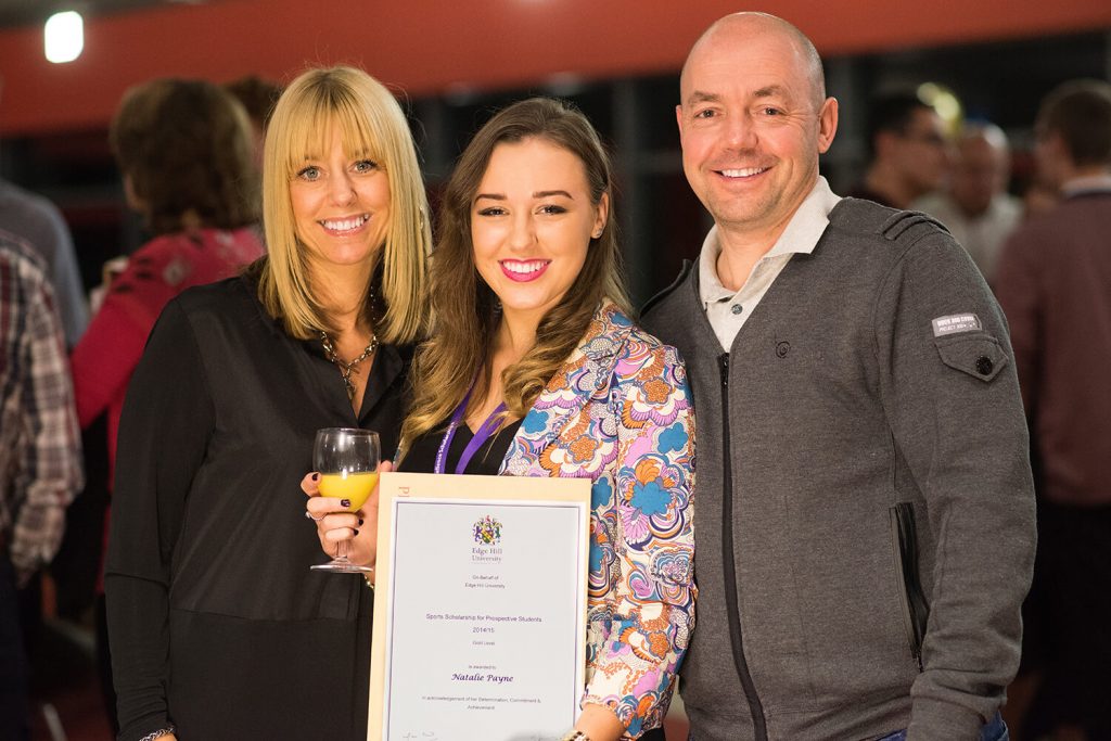Sports Scholarship winner Natalie Payne, with her parents, showing her certificate at a Scholarship Awards Evening.