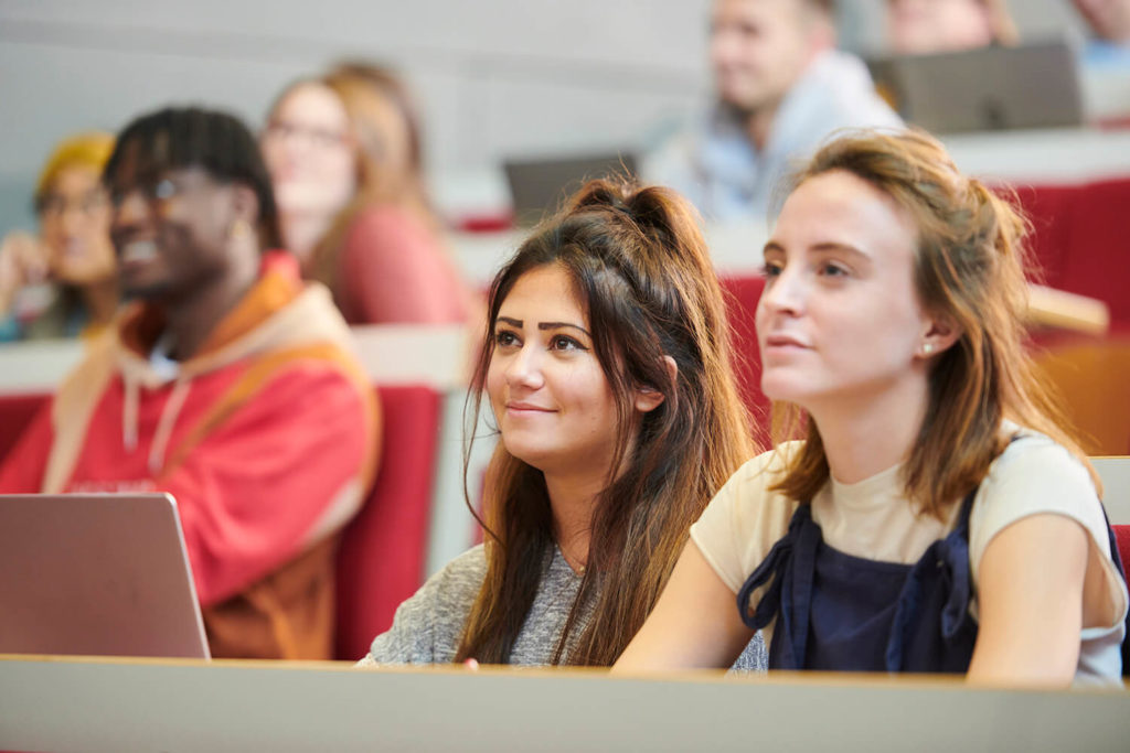 Students listen attentively during a lecture.