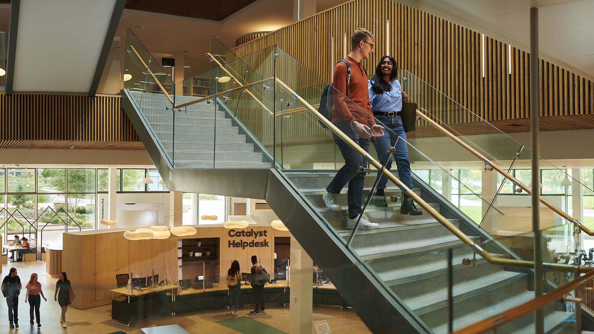A pair of students descend the steps in our Catalyst building.