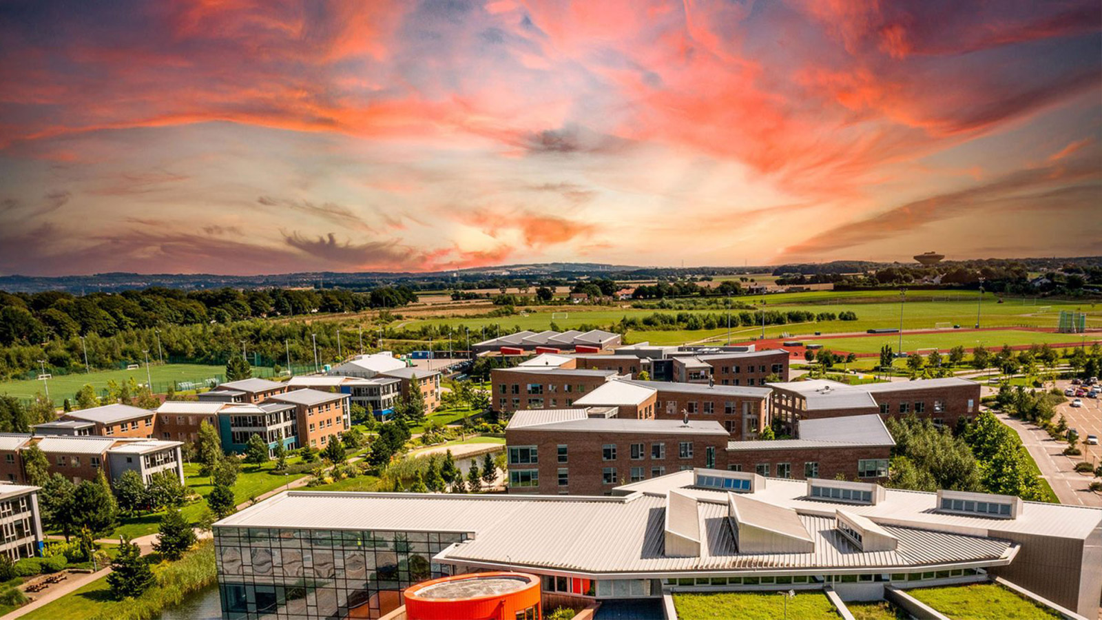 an aerial shot of edge hill at sunset
