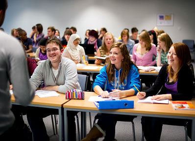 Students smiling during a lecture