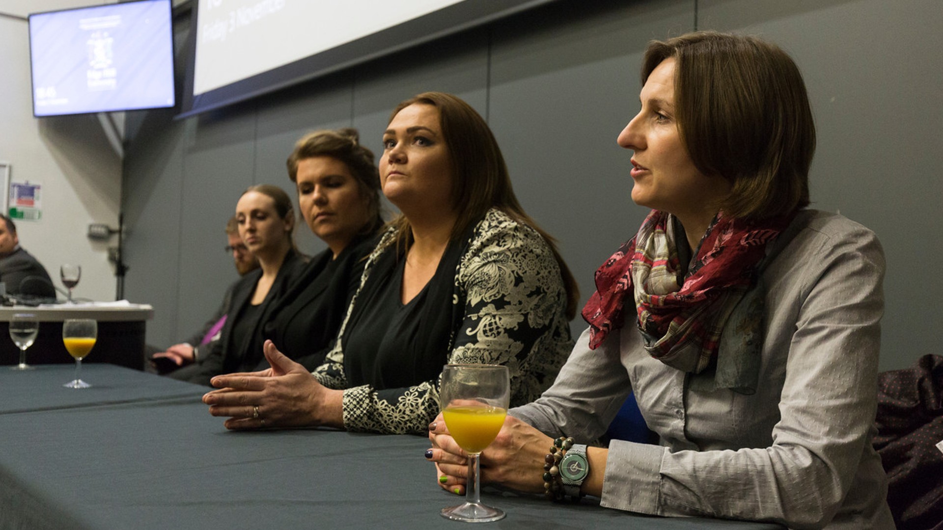 An image of five past law students talking on a panel.