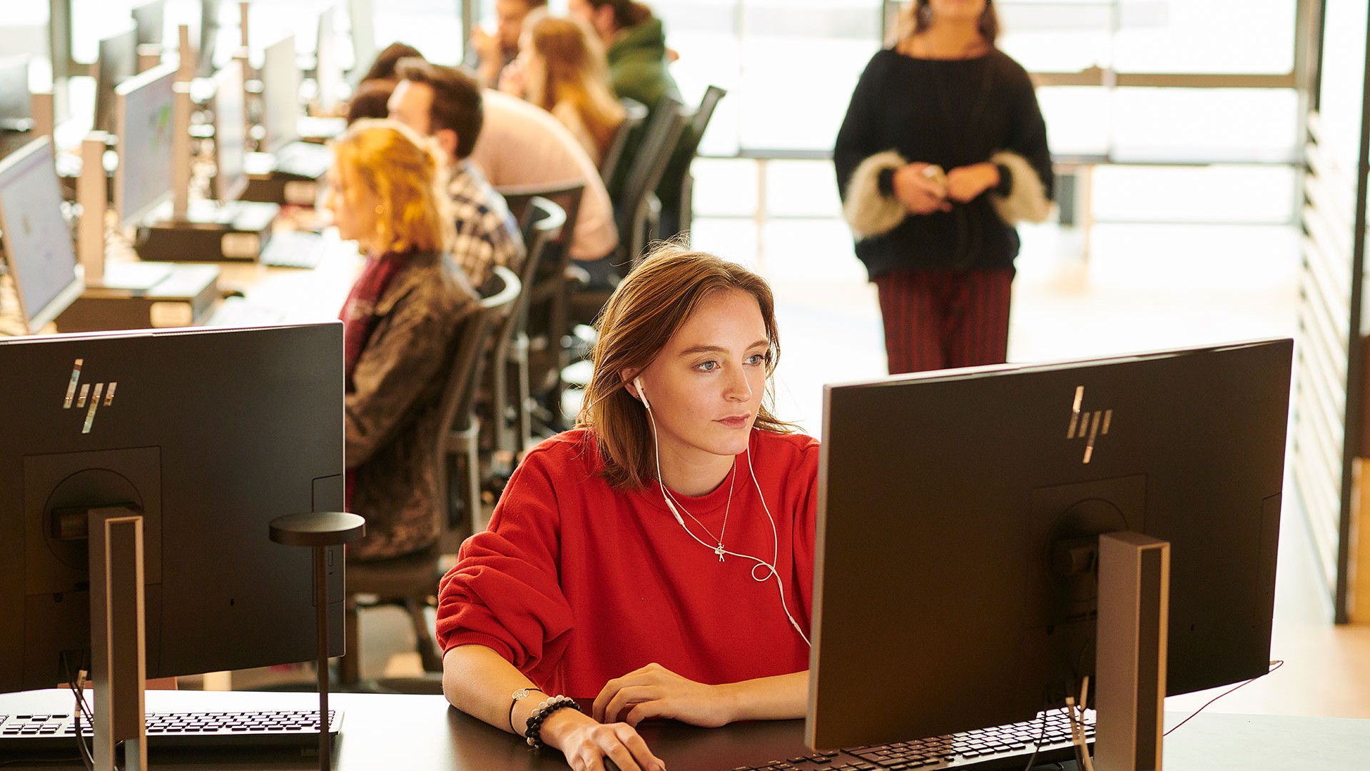 A student is sat in the Catalyst using a computer.