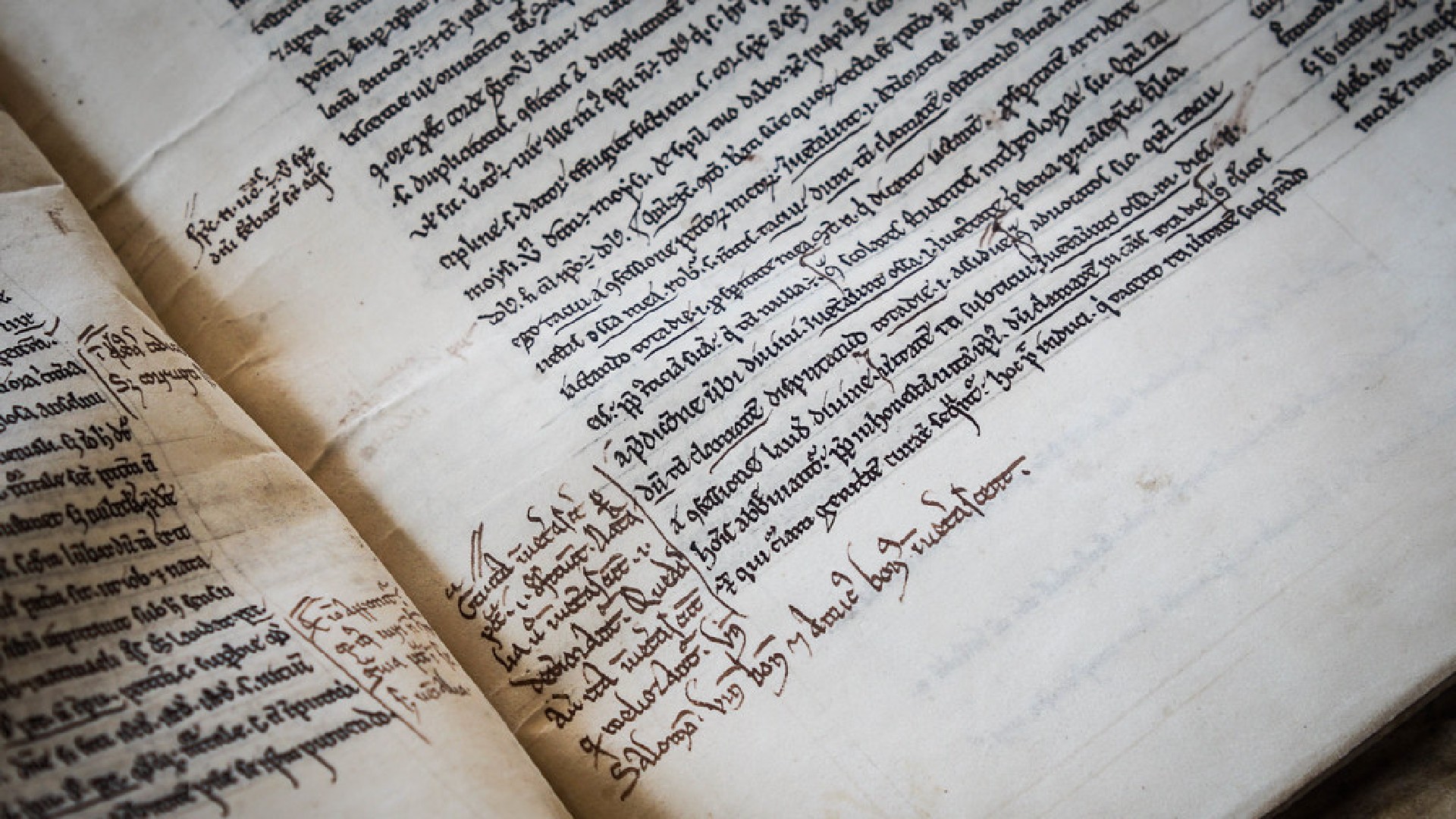 An image of a medieval book with text inside.