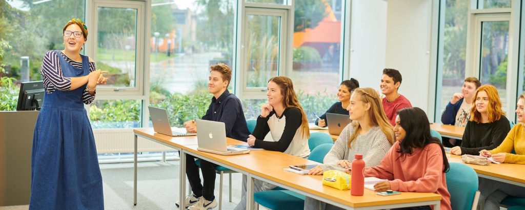 A lecturer addresses a classroom of students in the Law and Psychology building.