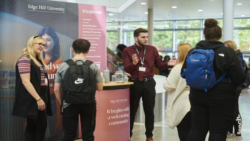 Edge Hill staff talk to students at a HE Fair
