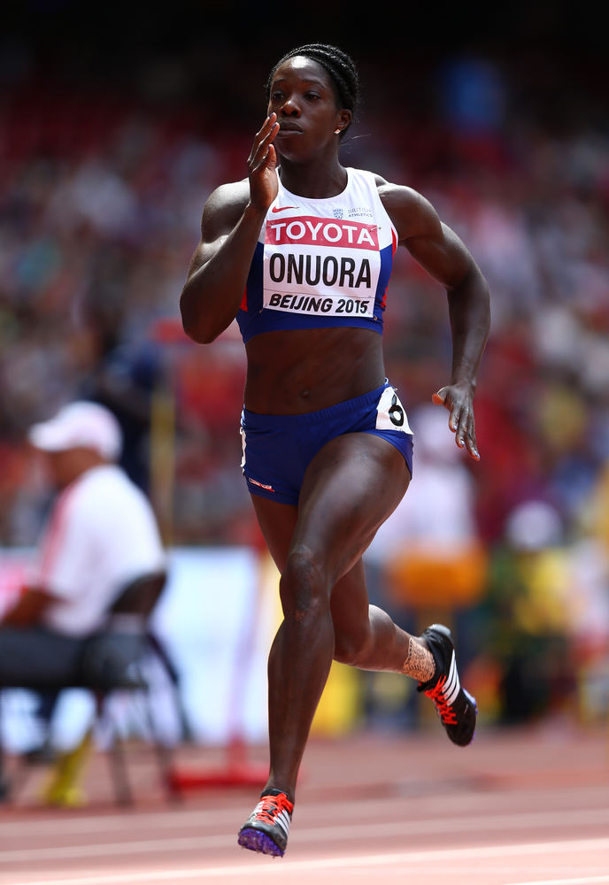 Anyika Onuora mid stride on an athletics track