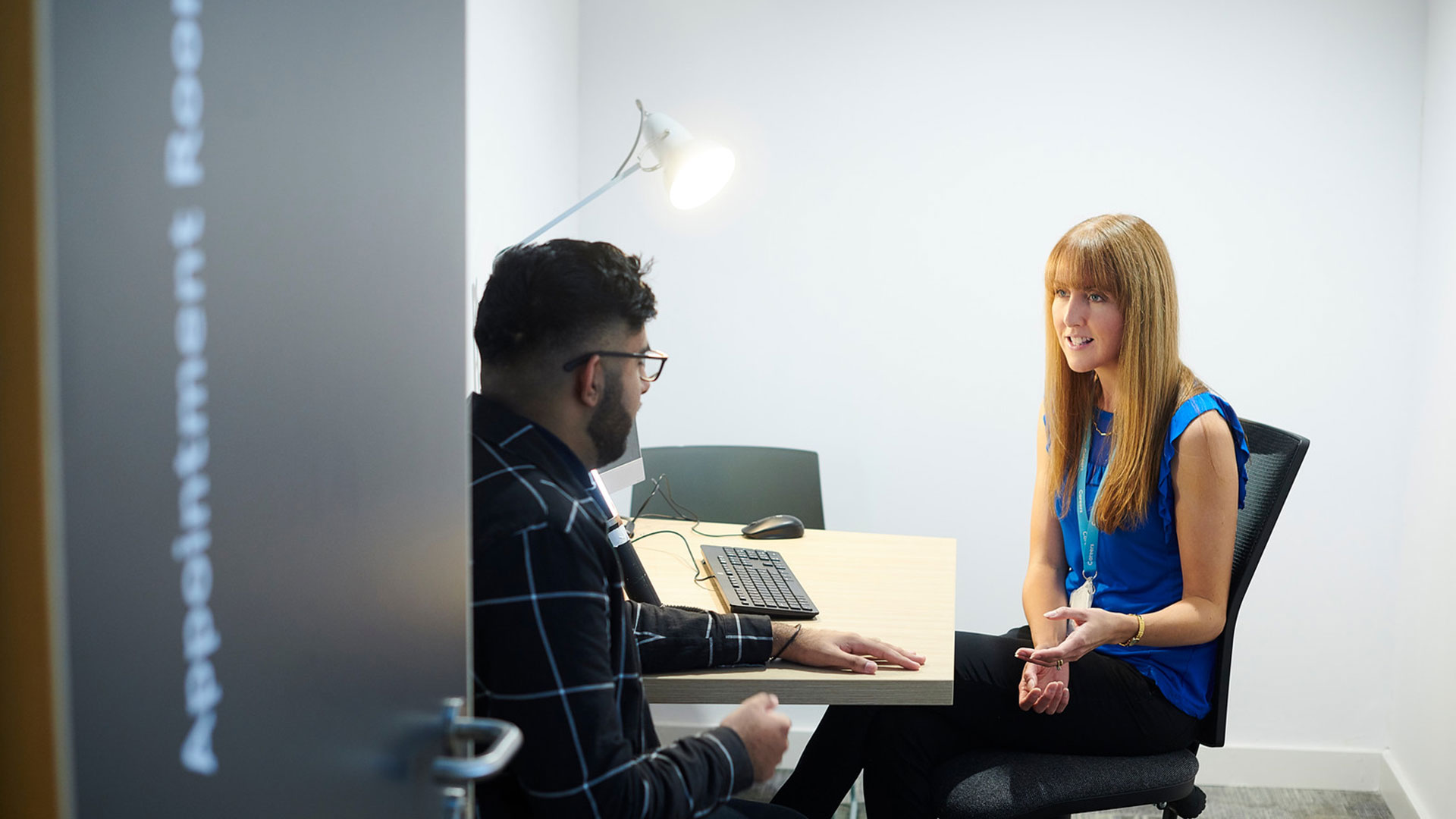 Student talks one on one to a member of our student services team.