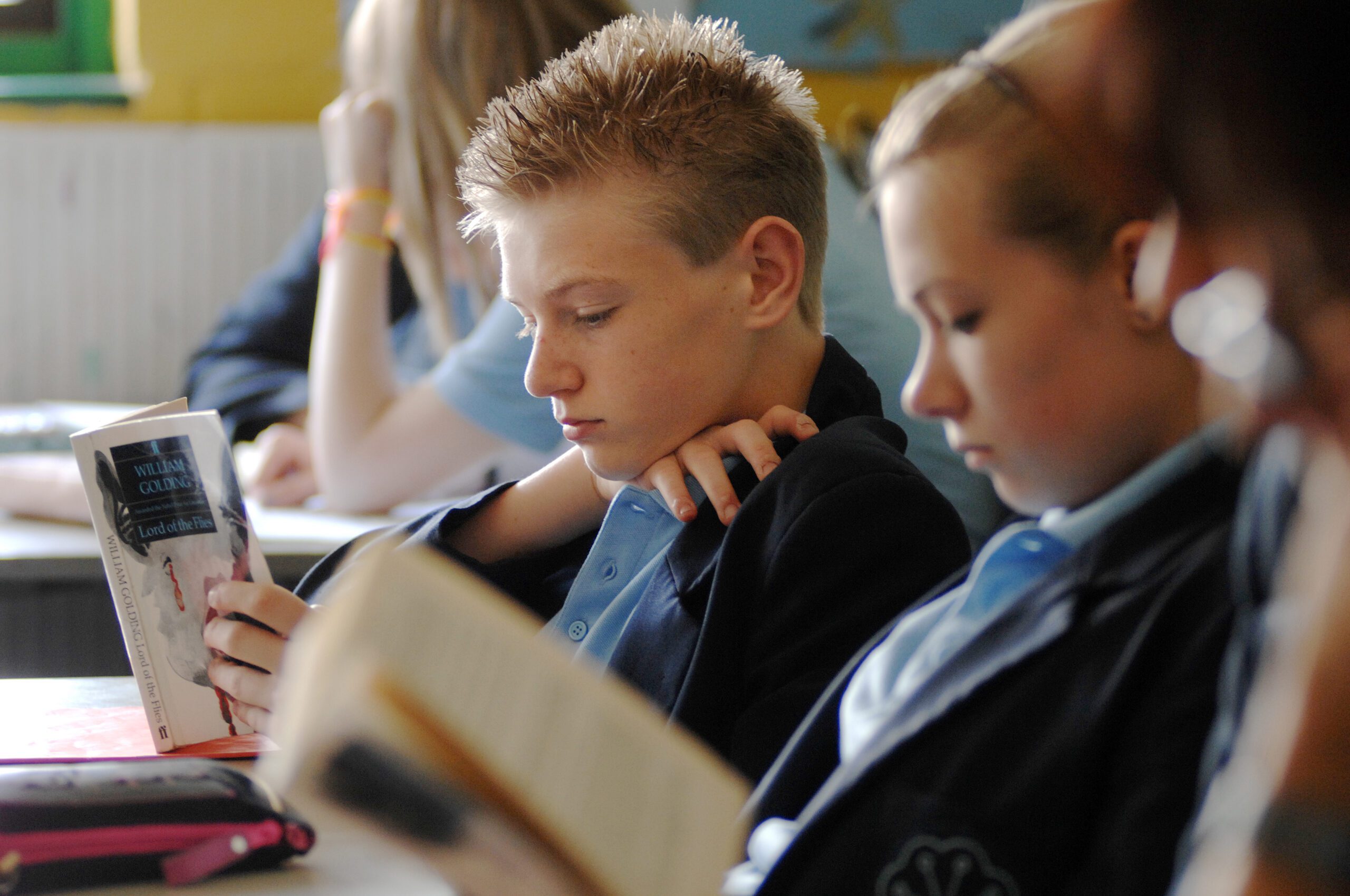 Children reading Books in school.