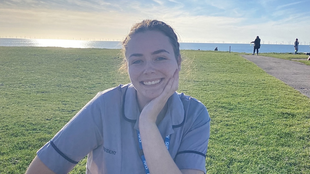 Jade Ainsworth wearing a nurses uniform and smiling