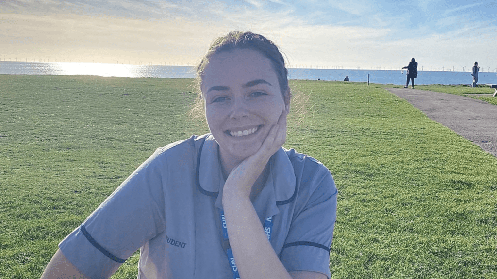 Jade Ainsworth wearing a nurses uniform and smiling