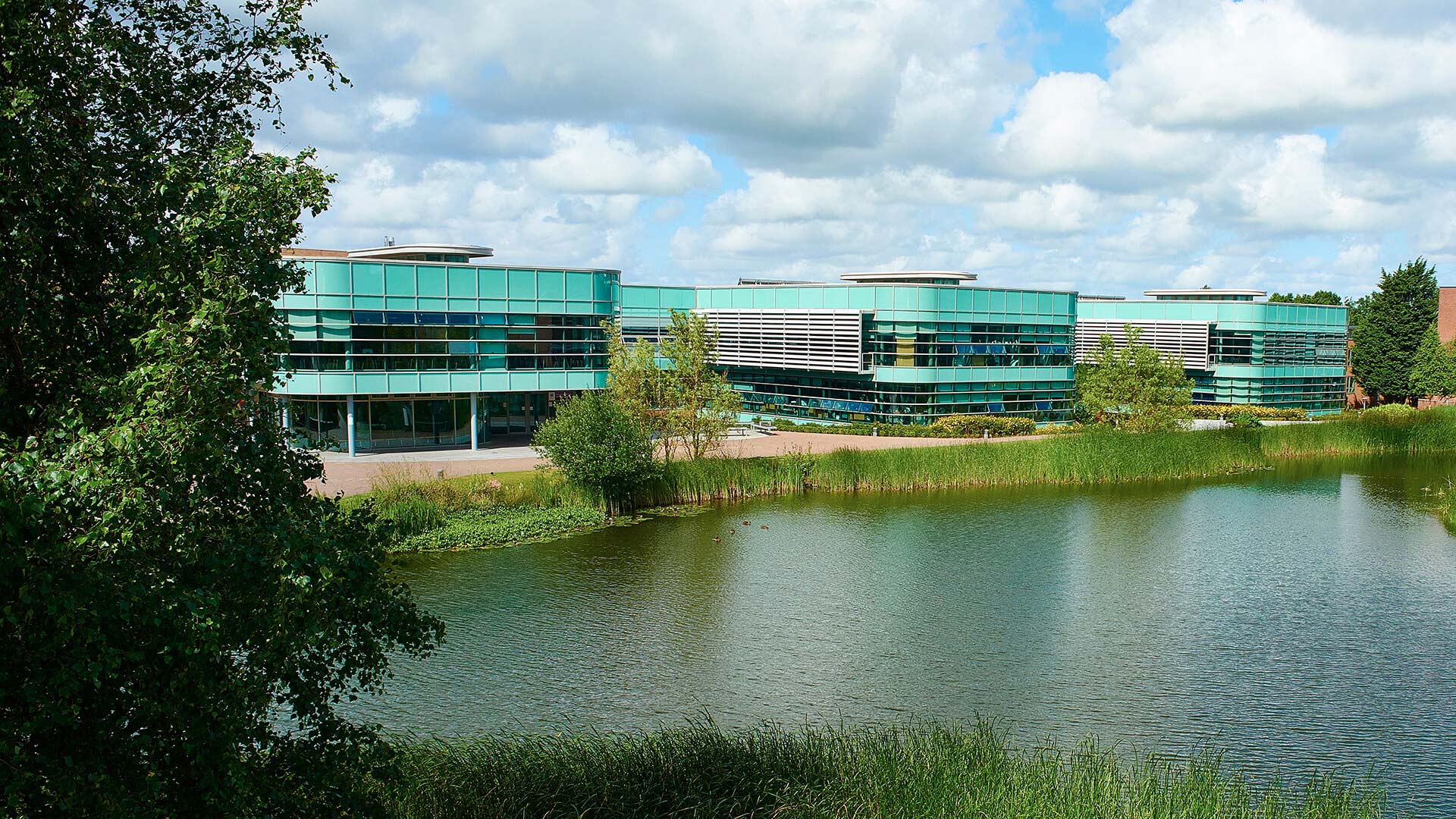 Exterior shot of the Faculty of Health and Social Care building over lakeside