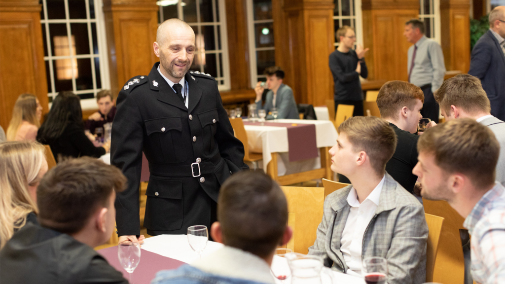 Professionals and students sat at table at the EHU Police Awards