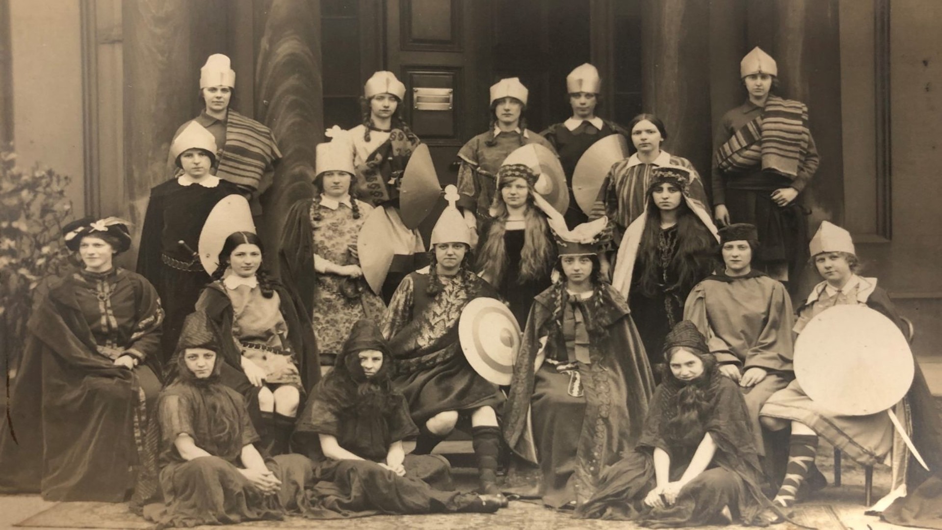 Historical, sepia toned photograph, 1914-1916. It shows a group of female students at Edge Hill College dressed in costume for a production of William Shakespeare's 'Macbeth'.