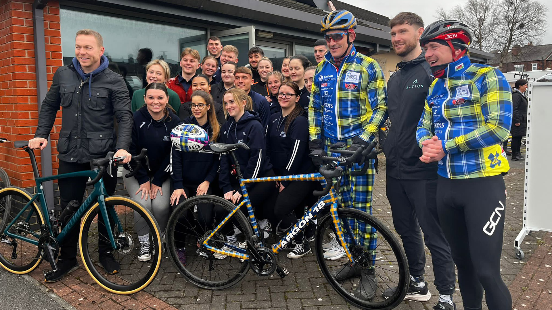 Edge Hill University Sports Therapy students pose with cyclists from the Doddie Weir charity ride