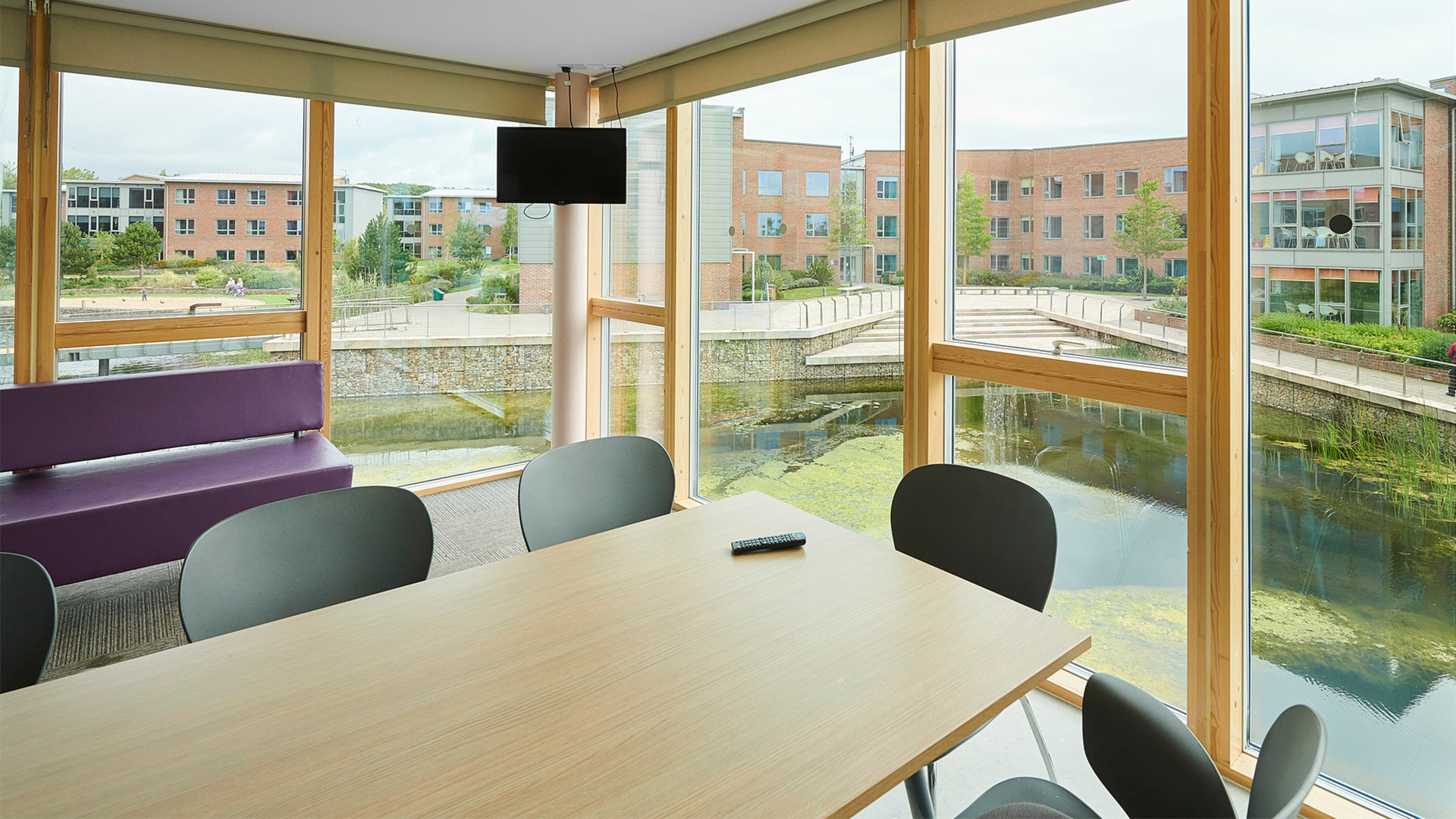 An Edge hill University halls living room with large window looking out onto campus