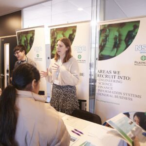 Alumni talking to students at careers fair