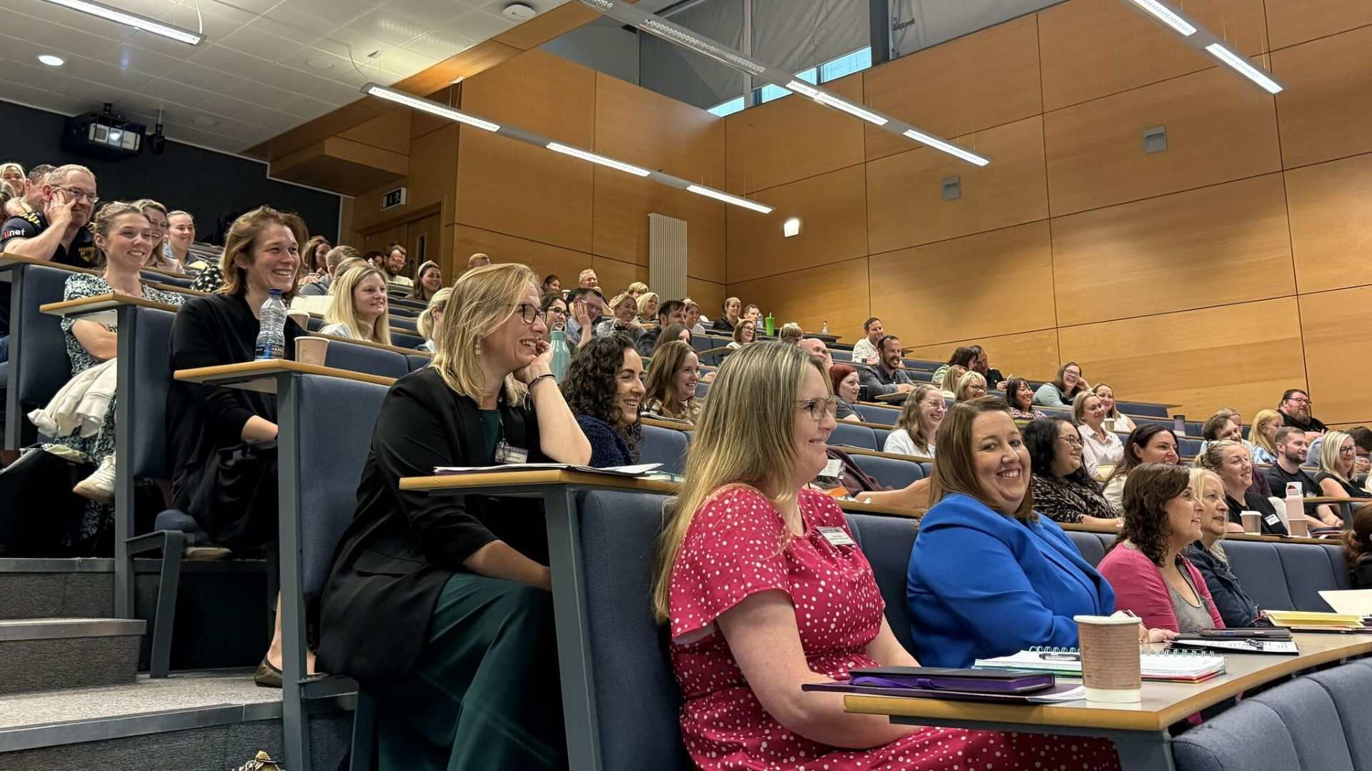 People sat in a lecture theatre