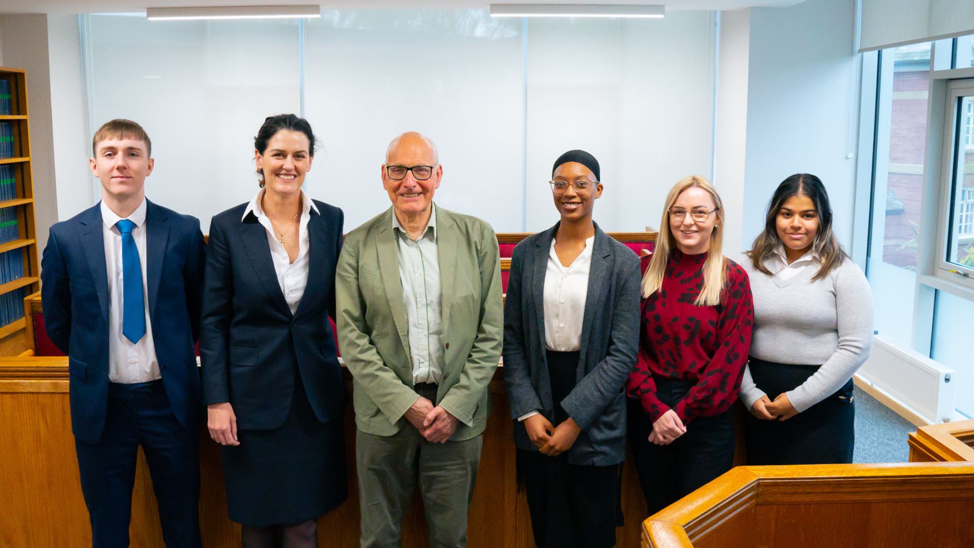 :aw students stood facing camera along side Nicholas Stewart and Dr Leanne O'Leary