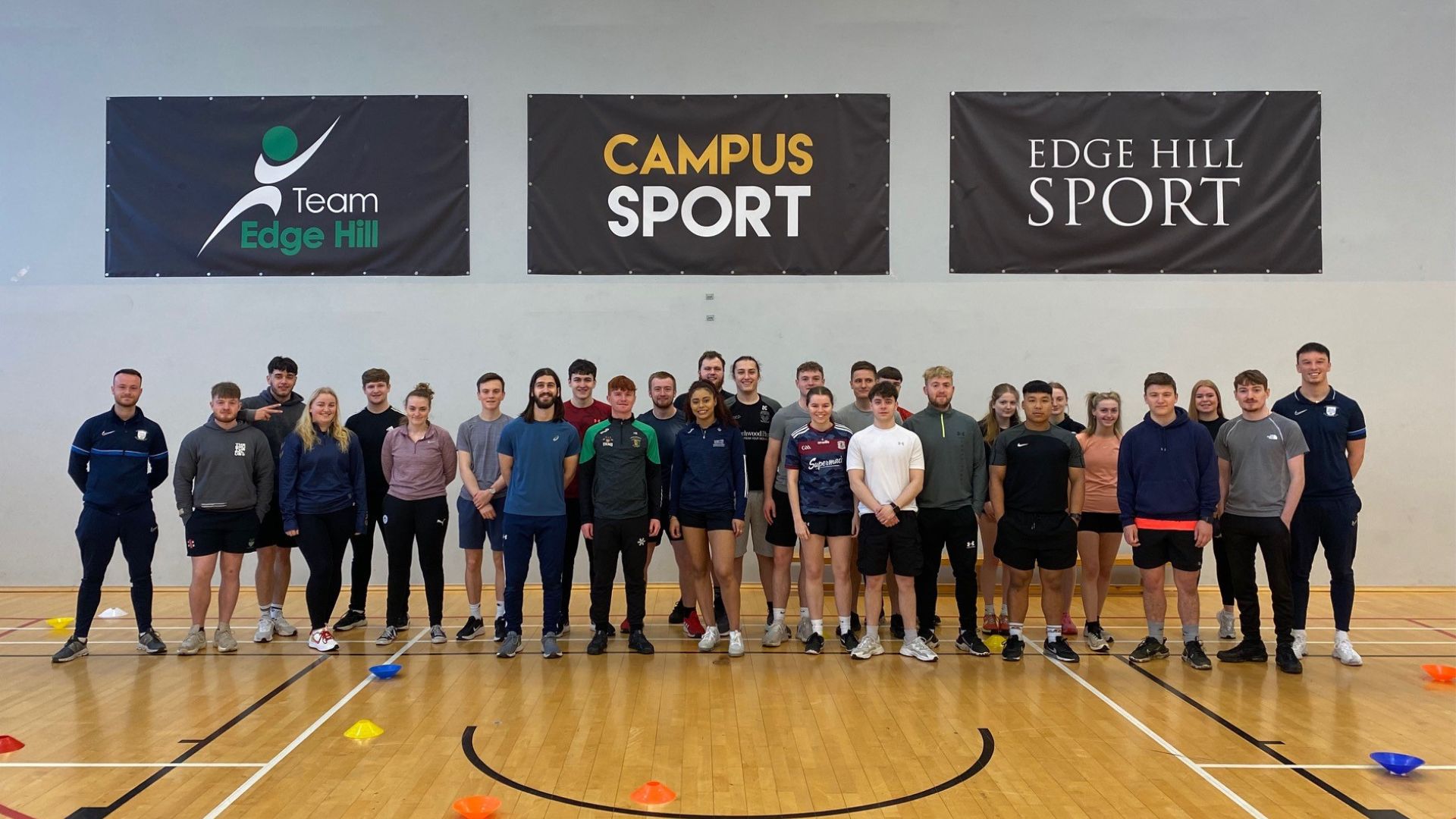 Sports Students group photo facing camera in the Wilson Gym