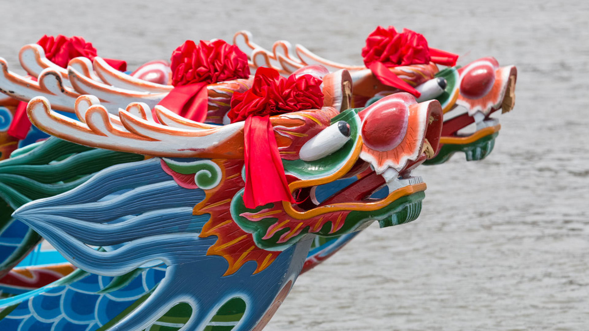 The head of a boat from the Dragon Boat Race. It is a blue and red dragon's head in traditional Chinese ornament.