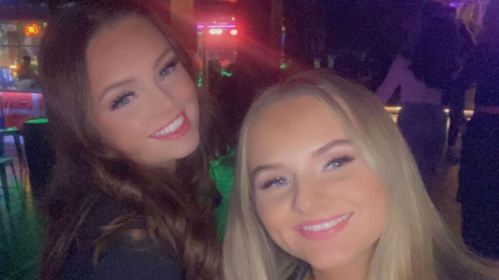 Freya and Eva smile to camera during a night out