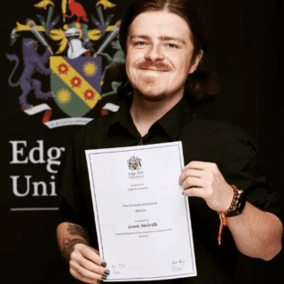 Lewis Melville holding BA (Hons) History & Politics graduation certificate.