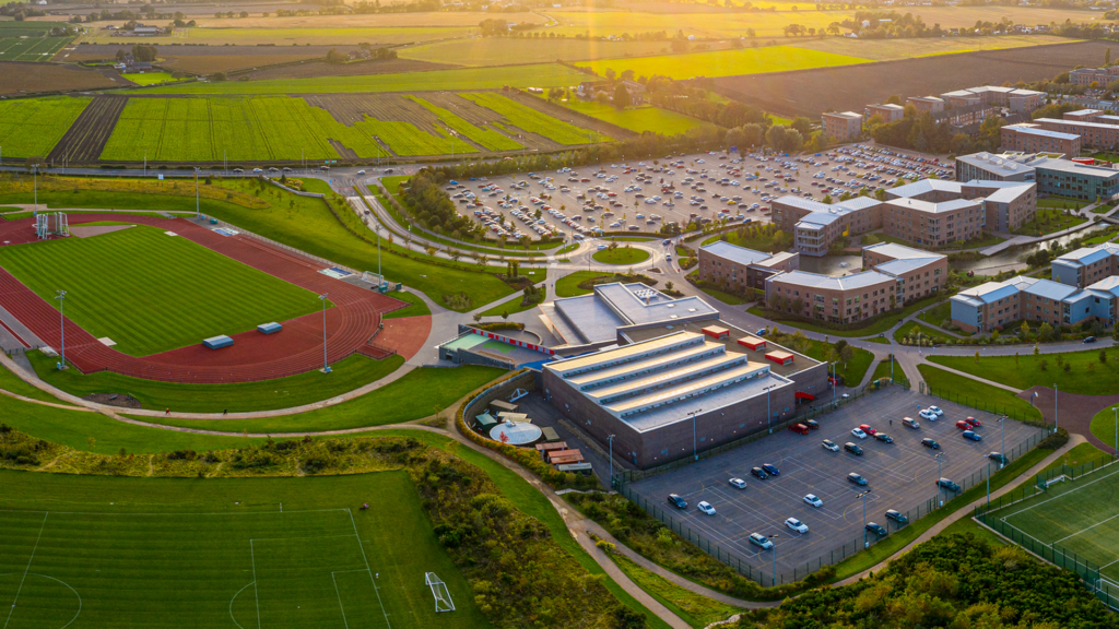 A high angle shot of the Eastern Campus showing the EHU Sport Centre and running track.