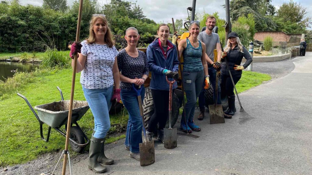 Volunteers with gardening tools