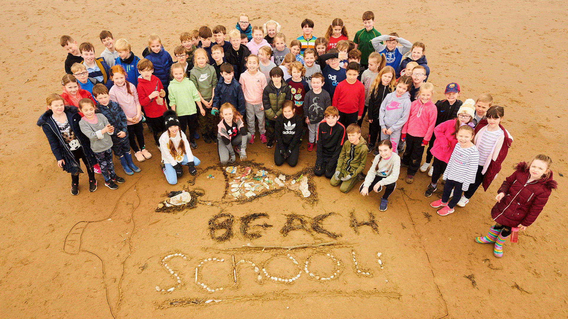 School children on the beach for the North West Beach School Network Conference.