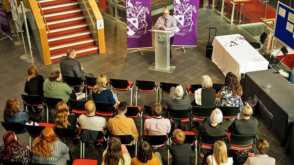 High angle shot of audience and speaker at the ACRE 2022 Transitions and Transformations event