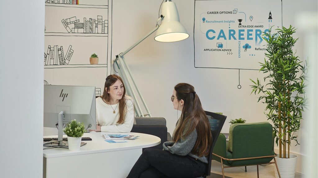 A student talks to a Careers advisor in Careers Corner