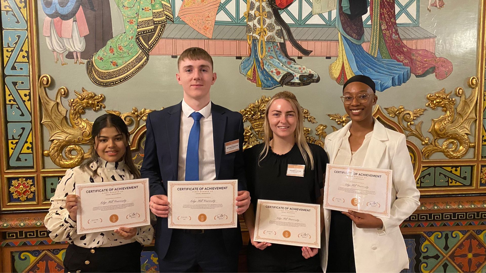 4 law students and senior lecturer holding certificates to camera at the sports mooting competition in Madrid