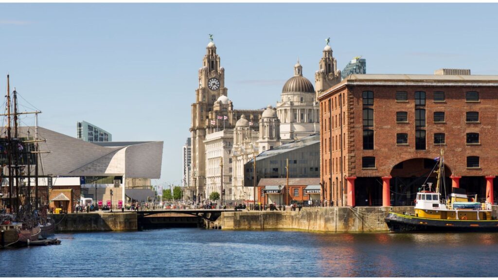 An image of the docks in Liverpool, featuring multiple large buildings