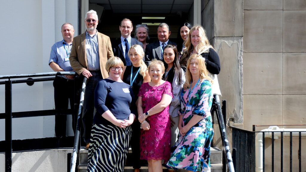 College staff gather for a group picture.