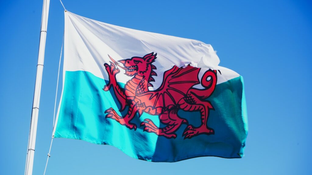 A Welsh flag waving in the wind.