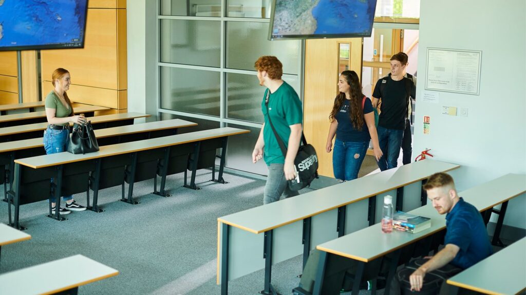 Students walking into a lecture theatre in the Geosciences building