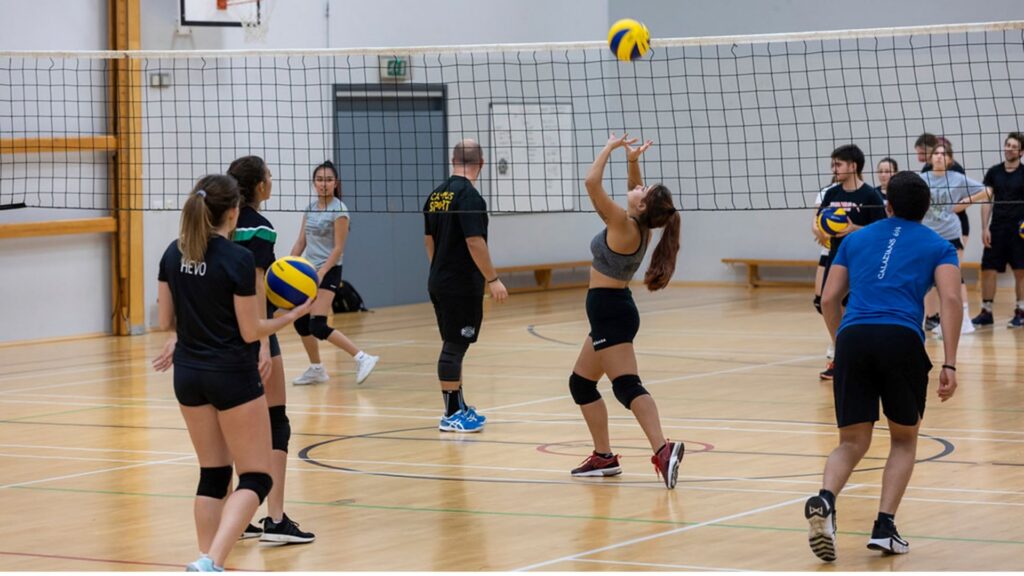 students playing volleyball