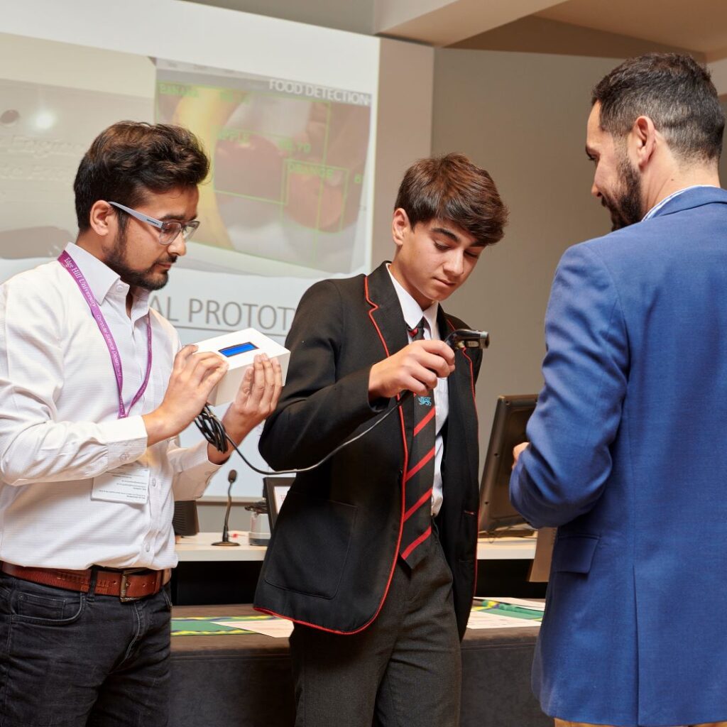 Students demonstrating the smart fridge.